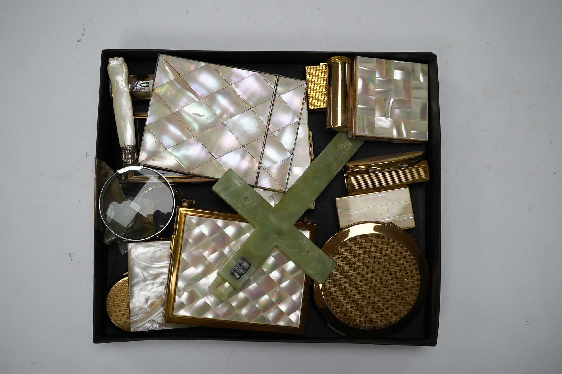 A collection of mother-of-pearl and enamel etc., compacts, boxes and a cross, card case 10.5cm high. Condition - fair to good